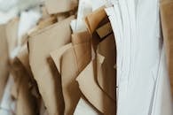 Detailed close-up of assorted sewing patterns on brown and white craft paper, perfect for DIY projects.